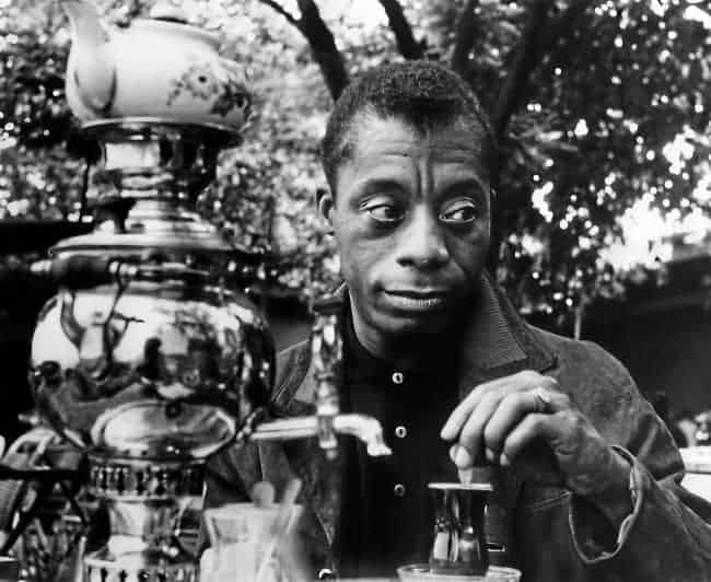 James Baldwin in 1965 drinks tea from a samovar in Istanbul, Turkey, his home for seven years, where he finished 