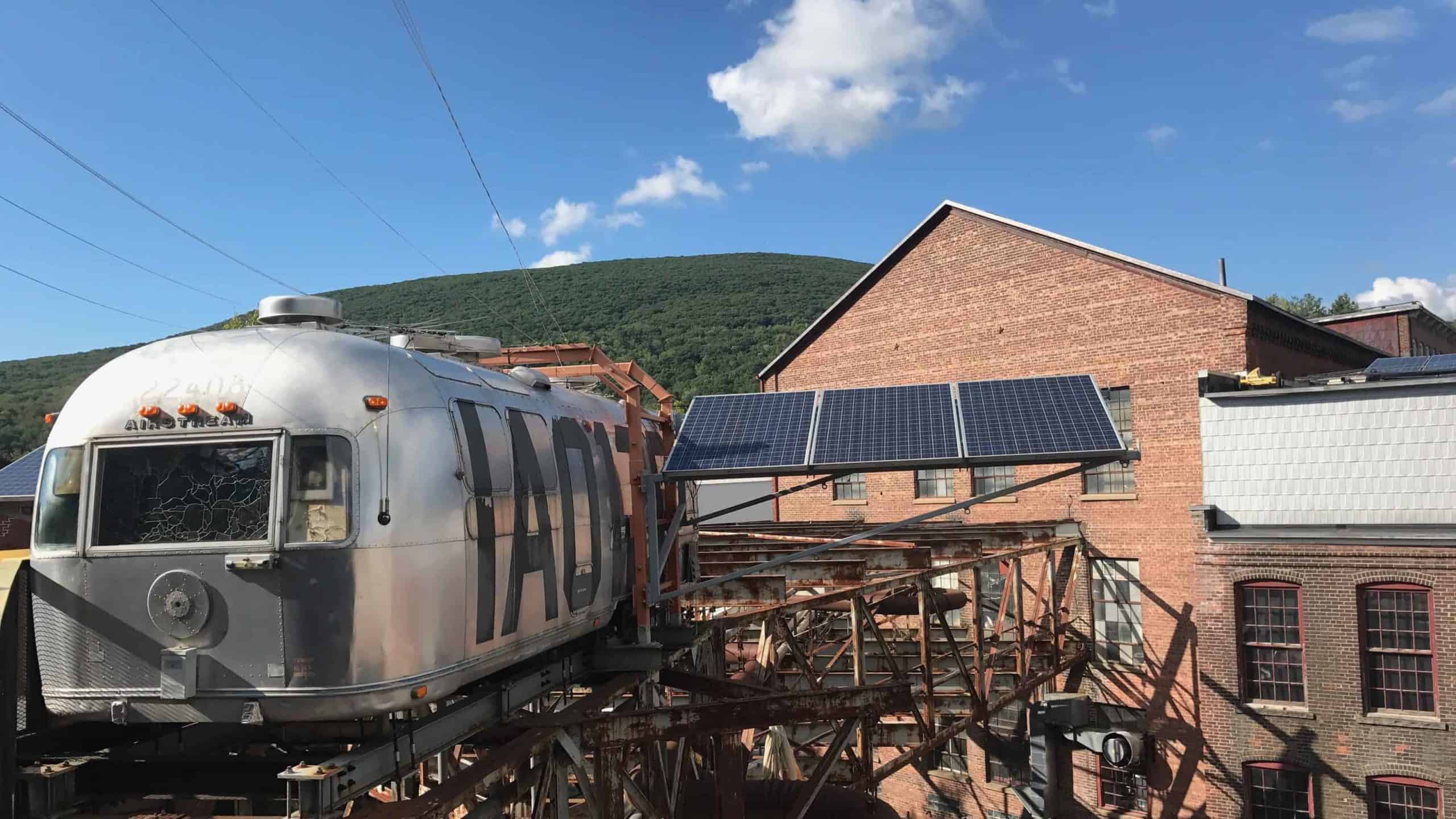 'The Shining,' Michael Oatman's silver Airstream vintage space ship, sits on the roof at Mass MoCA.