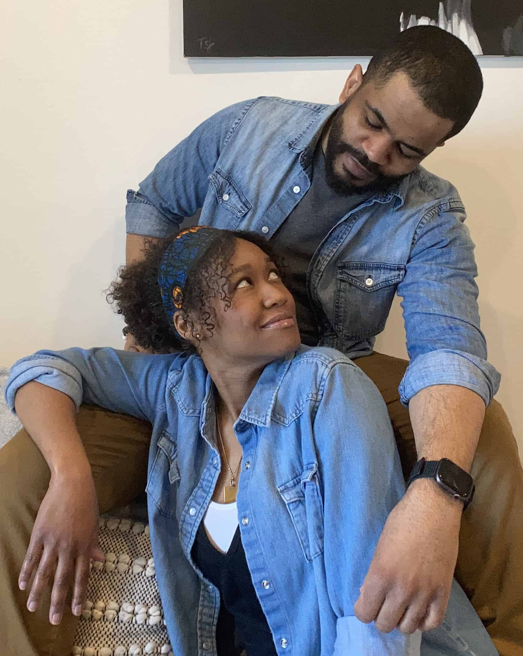 Boston-based actors Elle Borders and Brandon G. Green, a couple in real life as well as on stage, sit together on the couch as they rehearse for The Light with WAM Theatre. Press photo courtesy of the actors and WAM.