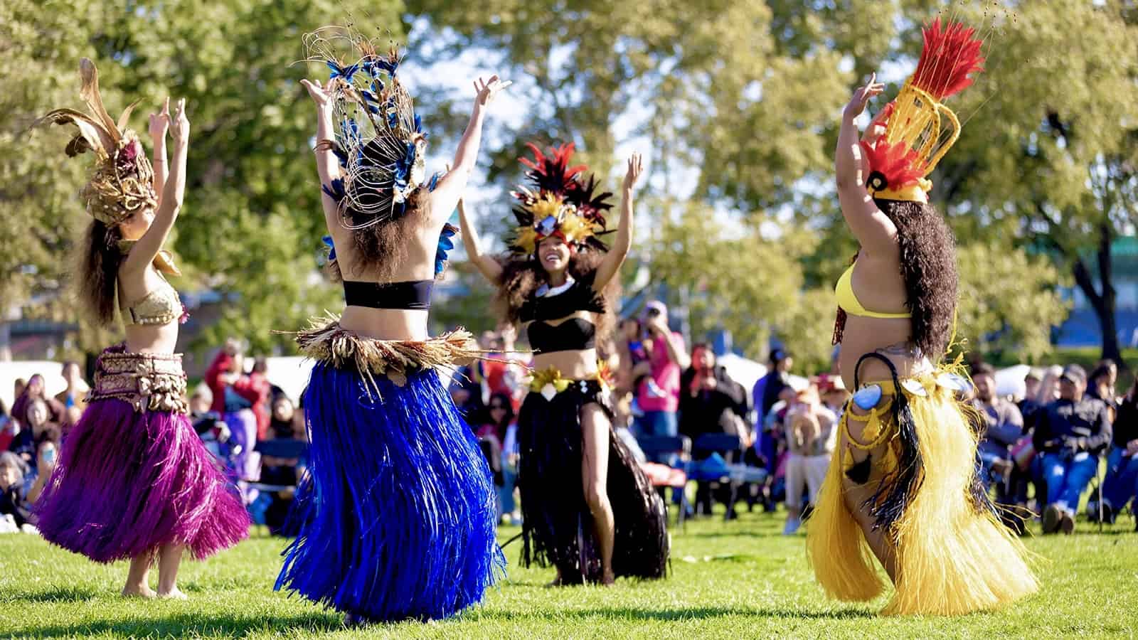 Te Ao Mana performs outside in the sun, a dance collective expanding the presence of Indigenous Polynesian culture worldwide. Press photo courtesy of Jacob's Pillow