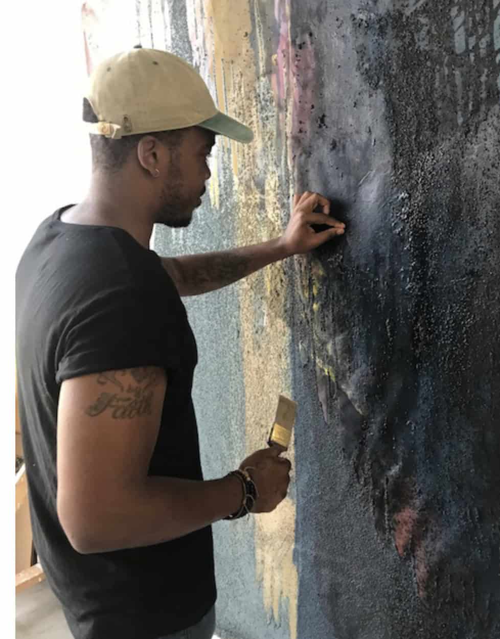 Abstract painter Patrick Eugène works on a canvas as a James Weldon Jonson artist fellow at Bard College at Simon's Rock. Press photo courtesy of the college