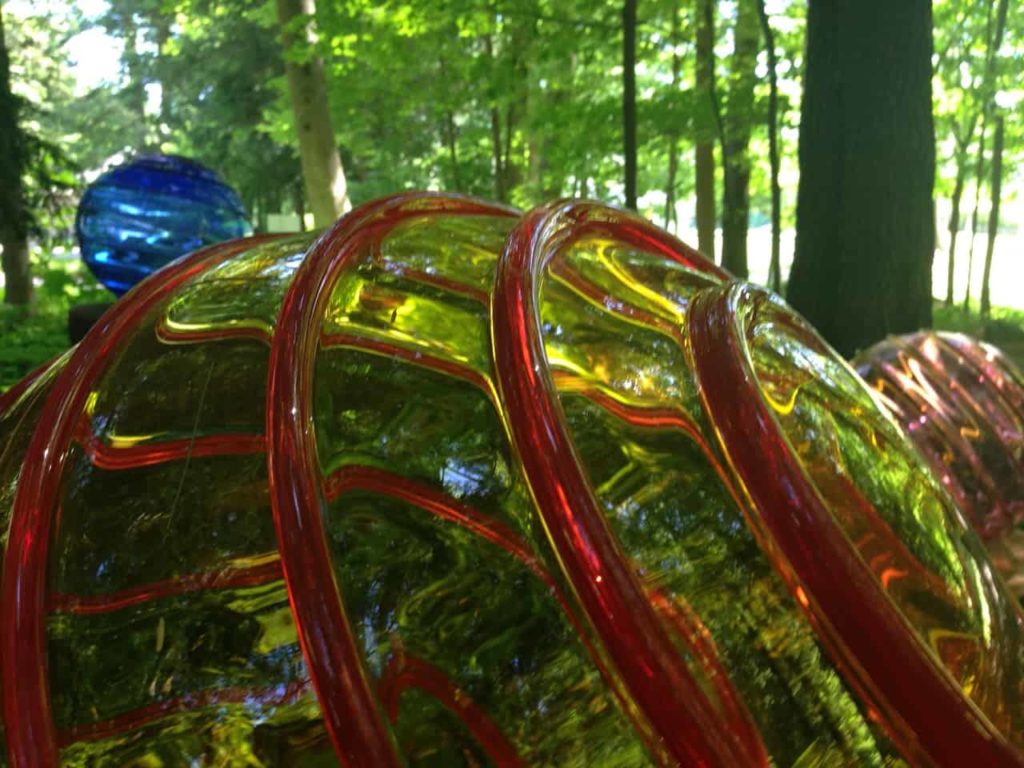 A blown glass globe in Richard Royal's "Optic Lens" reflects the trees at Chesterwood. Photo by Kate Abbott