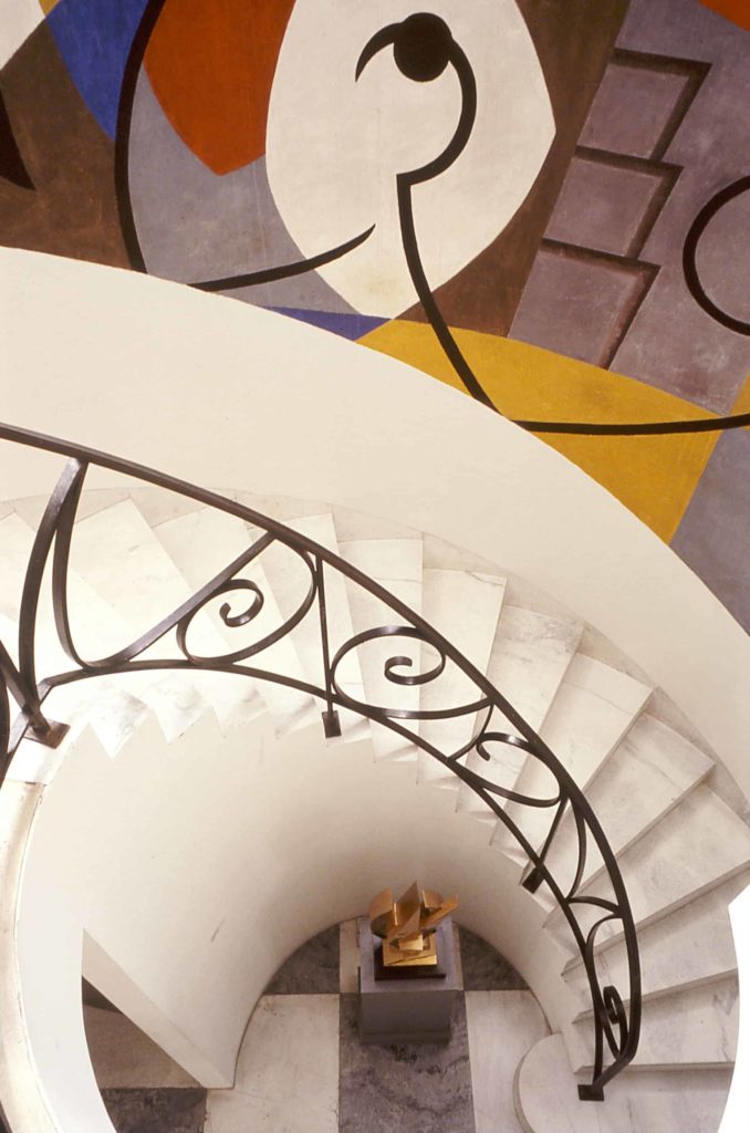 George L.K. Morris' mural follows the curve of the spiral stair in the foyer at the Frelinghuysen Morris House Museum in Lenox. Image courtesy of Kinney Frelinghuysen