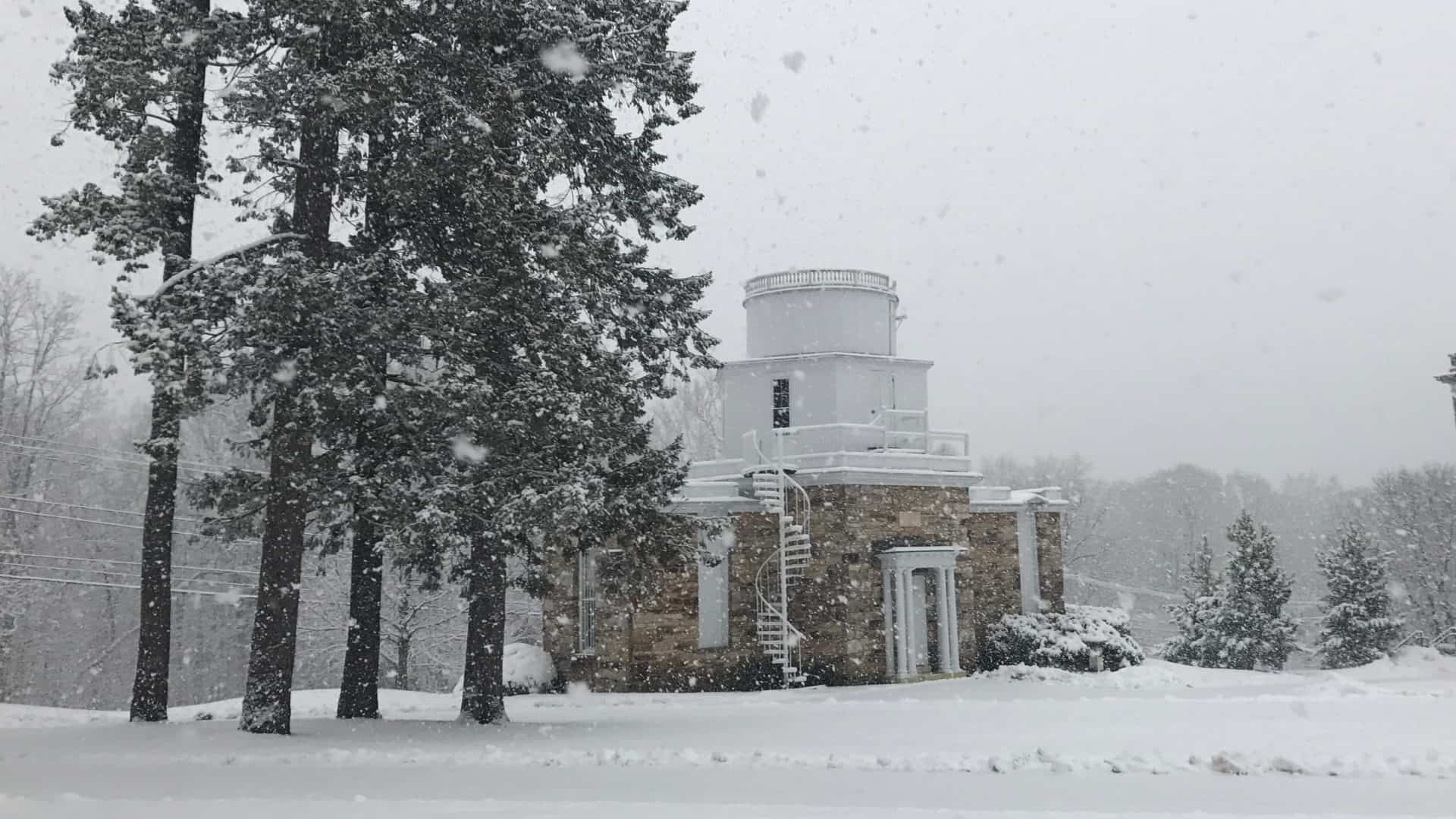 Snow falls on Hopkins Observatory, the old planetarium at Williams College.