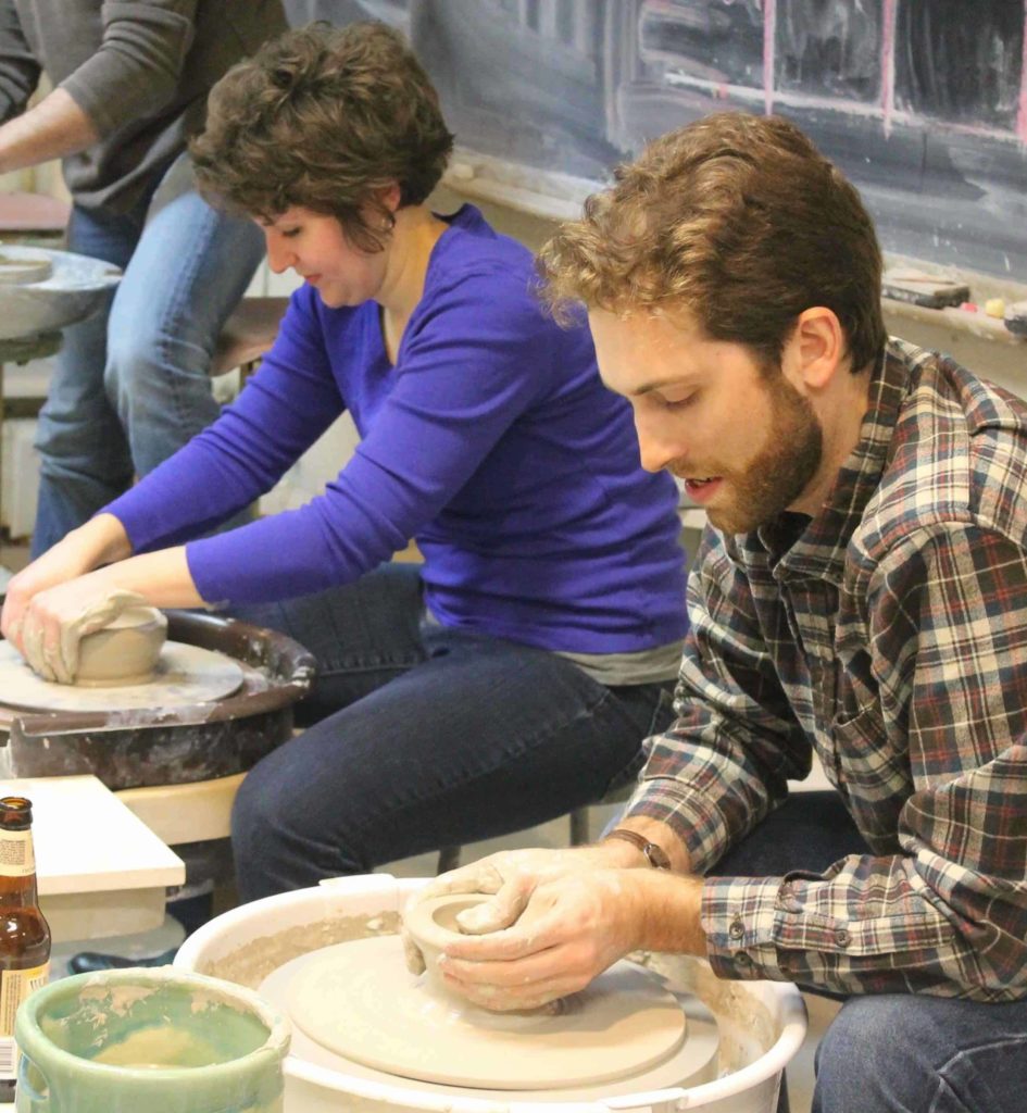 Ceramics students throw pots on a wheel at IS183 Art School. Photo courtesy of IS183