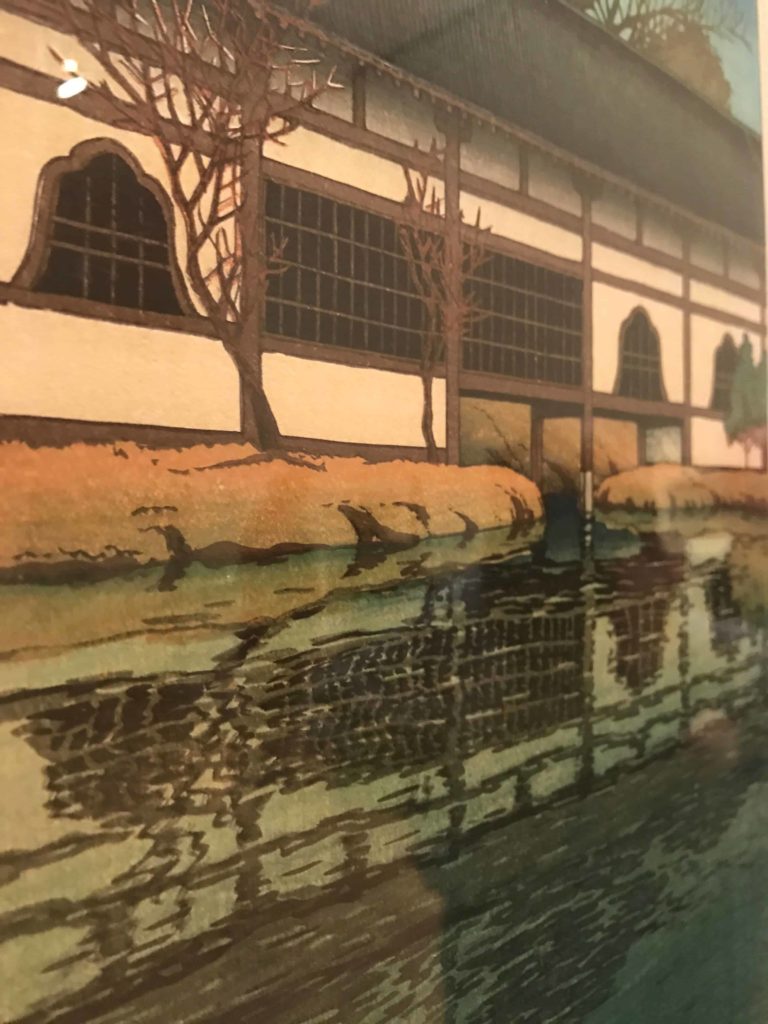 Kawase Hasui's 'Part of the Byōdō-in Temple at Uji' holds a reflection in clear green jade-water in an ukiyo-e woodblock print in Japanese Impressions at the Clark Art Institute.
