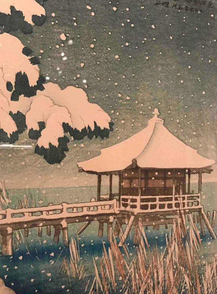 Snow falls gently on a cottage on the pier in Ito Shinsui's Floating Hall of Katada, an ukiyo-e woodblock print in Japanese Impressions at the Clark Art Institute.