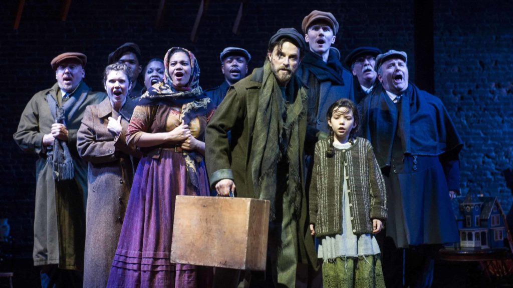 The cast of 'Ragtime' at Barrington Stage sing together as new Americans arriving in New York.