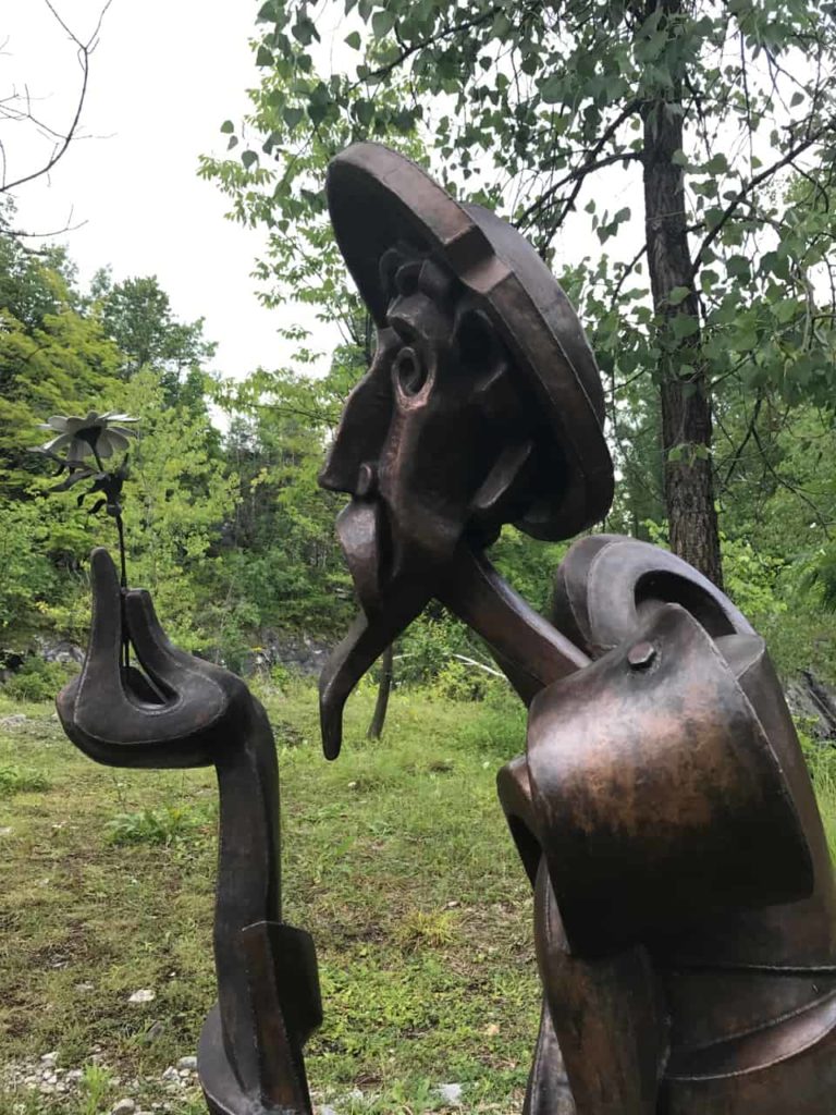 Don Quixote contemplates a flower in bronze at Turn Park Art Space in West Stockbridge.
