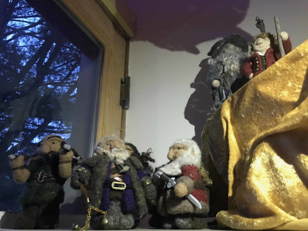 GJ.R.R. Tolkein's 13 dwarves and one Hobbit confront a gleaming dragon in a Going Gnome wool sculpture.