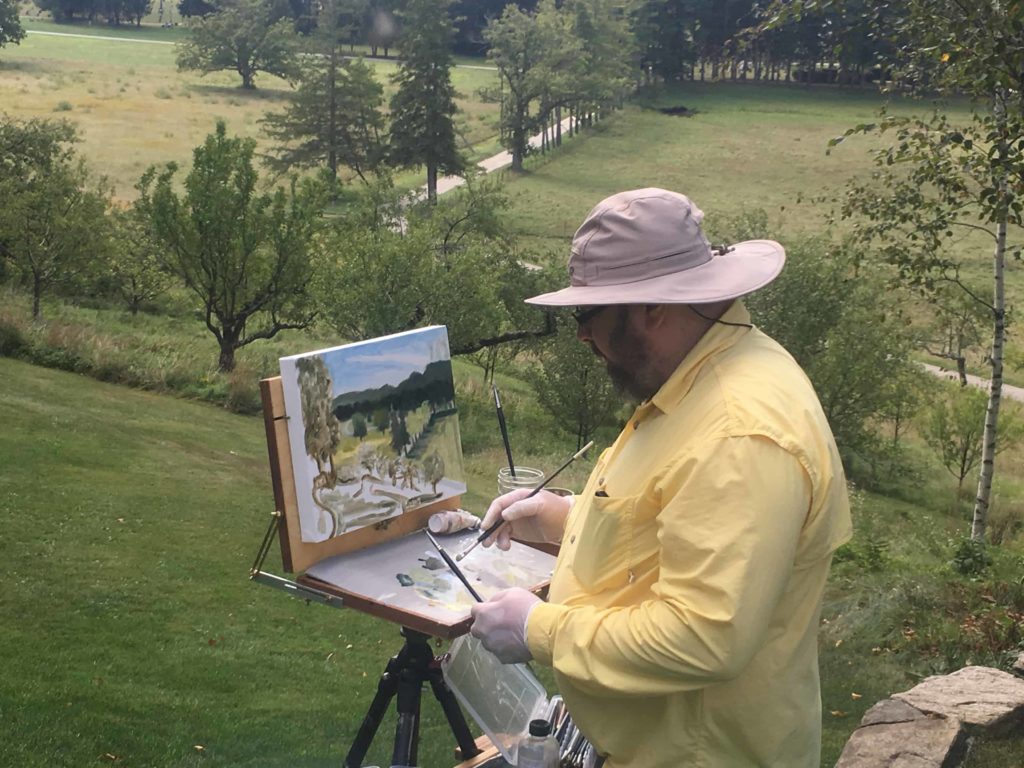 A plein air painter from the Guild of Berkshire Artists captures an outdoor scene.