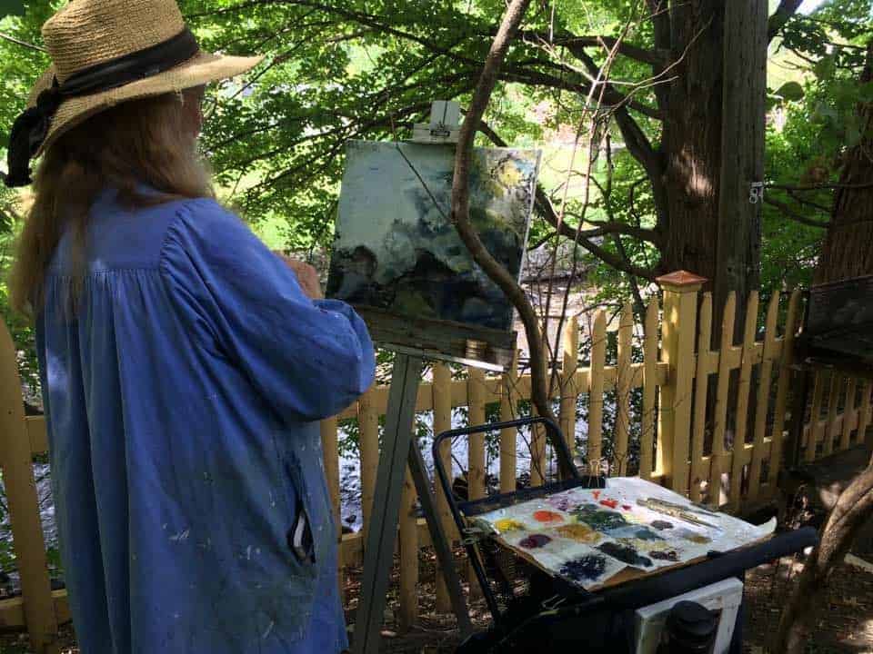 A plein air painter from the Guild of Berkshire Artists captures an outdoor scene.