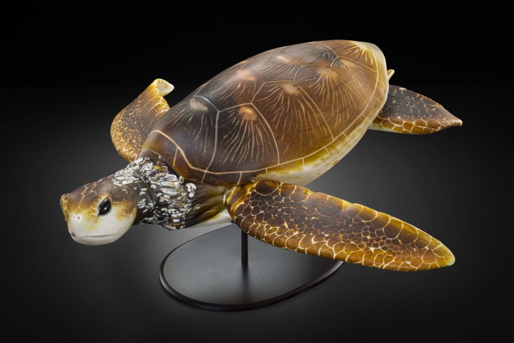 West Coast glass artist Raven Skyriver shapes a sea turtle in glass.