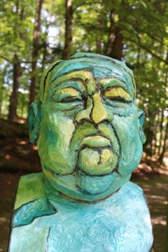 A sculpted head in an artwork in Sculpture Now 2018 on the grounds of the Mount in Lenox.
