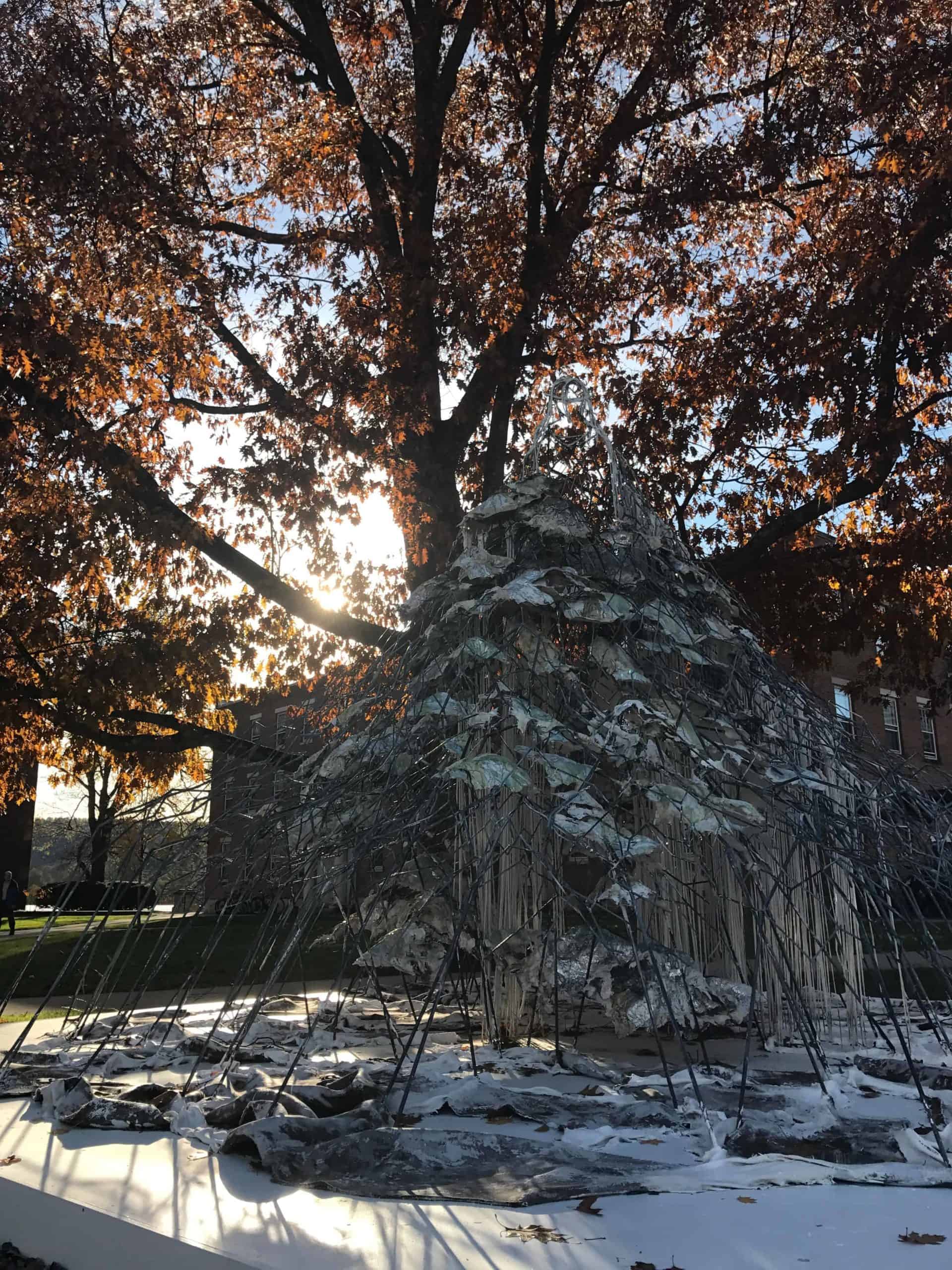 One element of Diana Al-Hadid's 'Delirious Matter' stands under an oak tree n the Berkshire quad at Williams College.