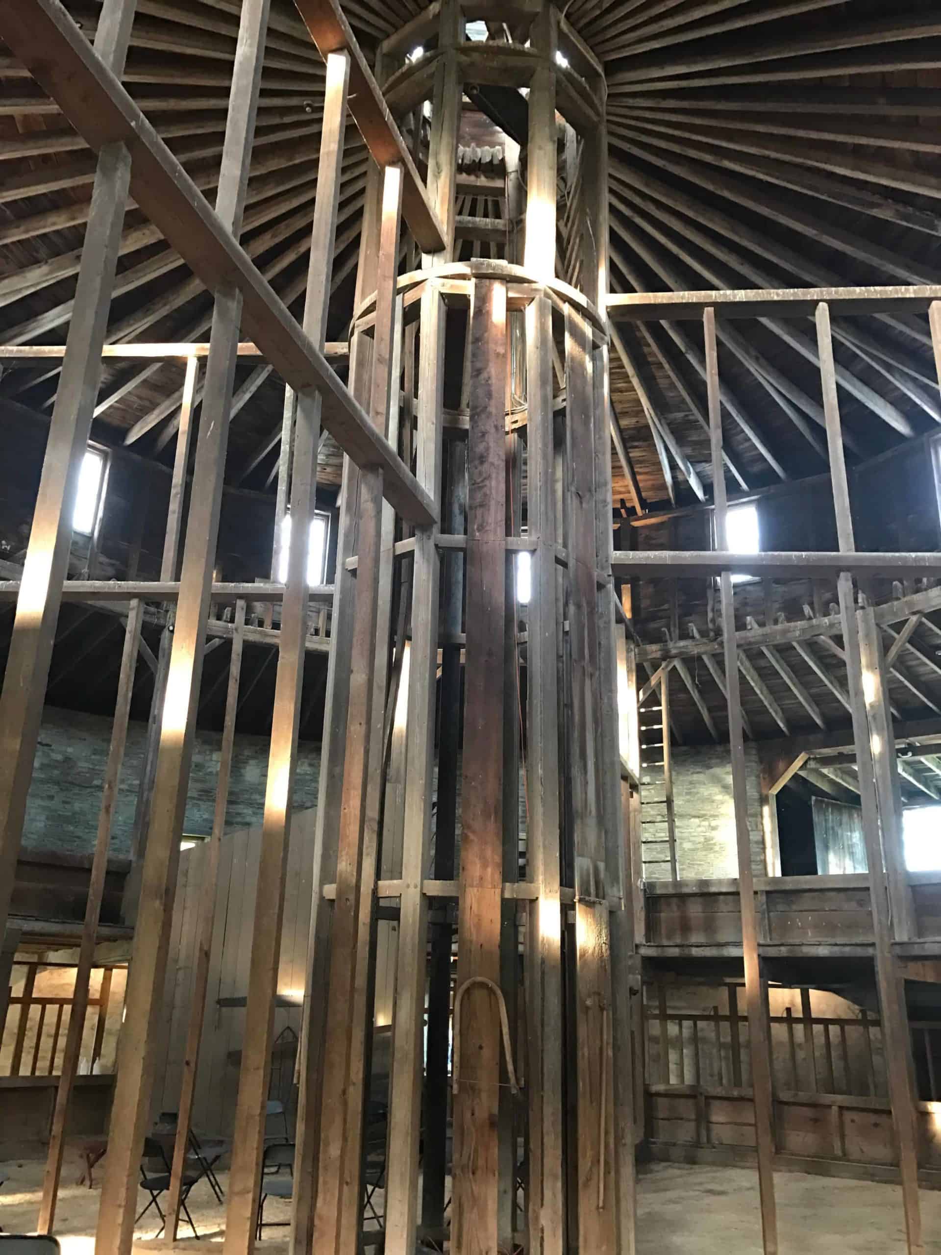 Light falls through the central column of the Round Stone Barn.