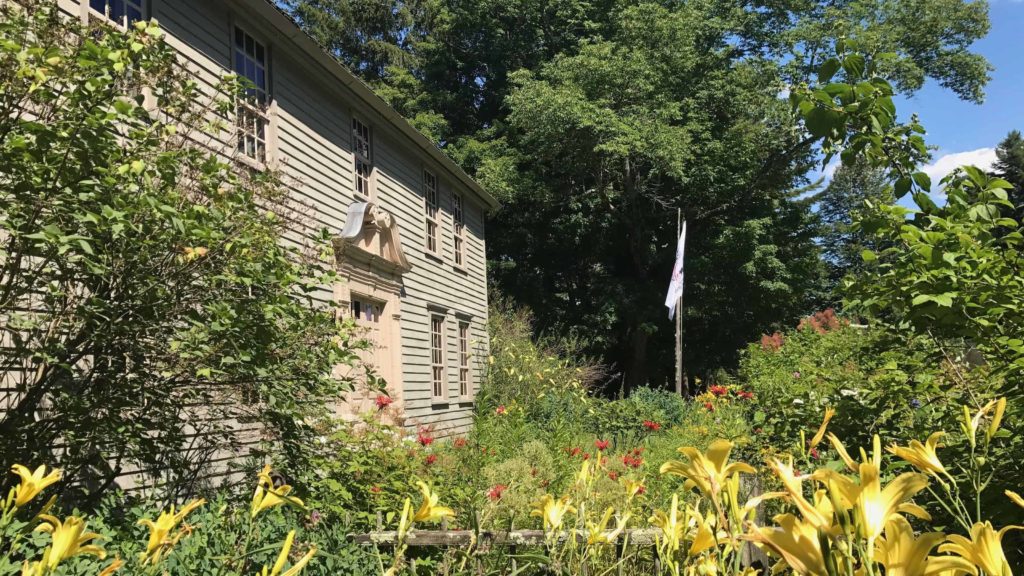 The flag of the Stockbridge Munsee Nation, the Mohican people, flies at the Mission House in Stockbridge.