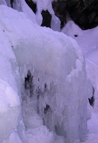 Intricate caverns worm through the frozen water of Wahconah Falls.