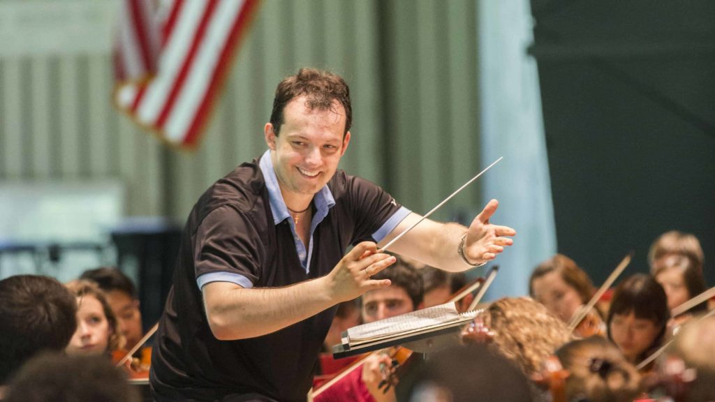 Andris Neslons rehearses with Tanglewood Music Center musicians at Tanglewood in Lenox. Photo by Marco Borggreve