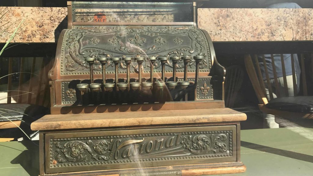 A vintage cash register glints at the entrance to Brew Haha café and coffee shop in North Adams.