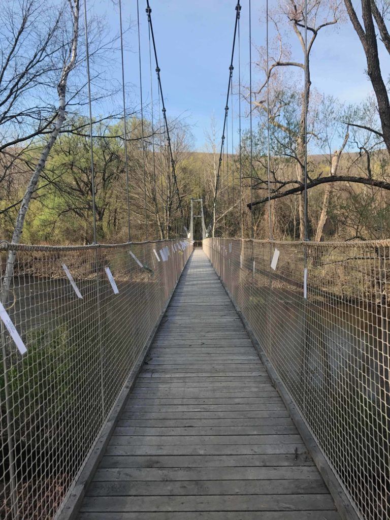 A local exhibit of poems celebrate the Hoosic River on the suspension bridge at Tourists Welcome in North Adams.