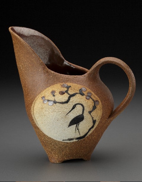 A high-spouted pitcher by ceramics artist Connie Talbot.