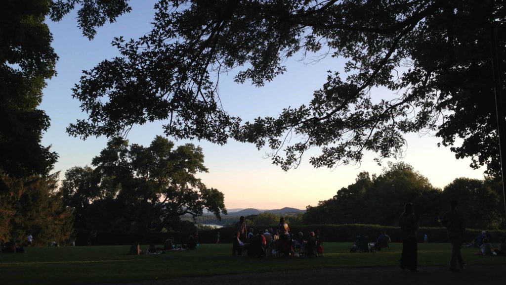 The Tanglewood lawn in Lenox looks out over Stockbridge Bowl at sunset.