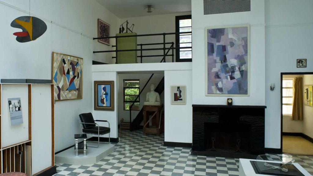 Suzy Frelinghuysen and George Morris' studio shows their Modern artwork and others'.