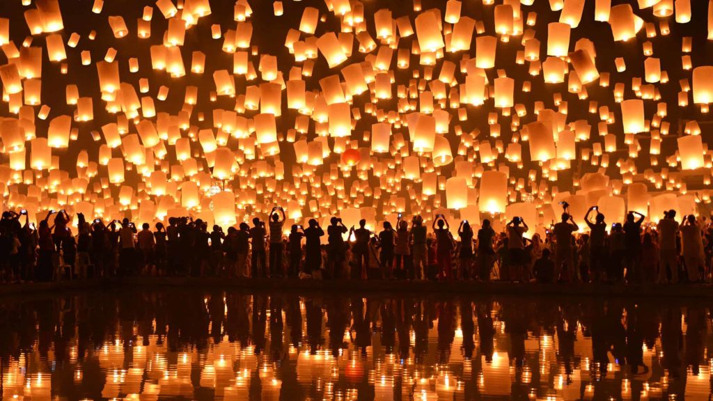 The night sky fills with light as lanterns soar and reflect a mirror image in the surrounding water. At the Loy Krathong festival, which usually takes place at the end of rainy season in Thailand, festivalgoers release lanterns to protect against bad luck. (Nanut Bovorn, Thailand)