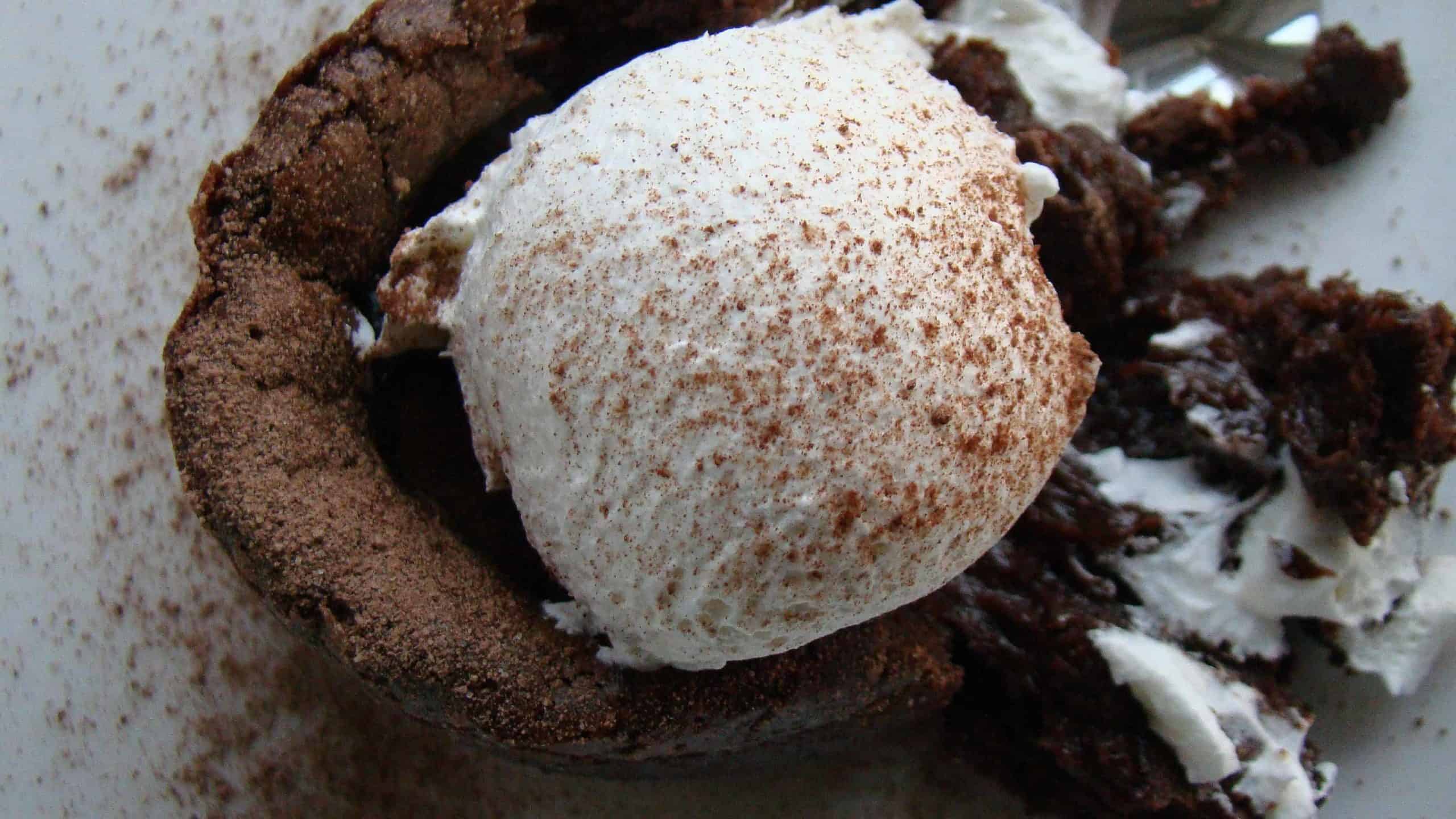 Chocolate lava cake with cream, Creative Commons courtesy photo