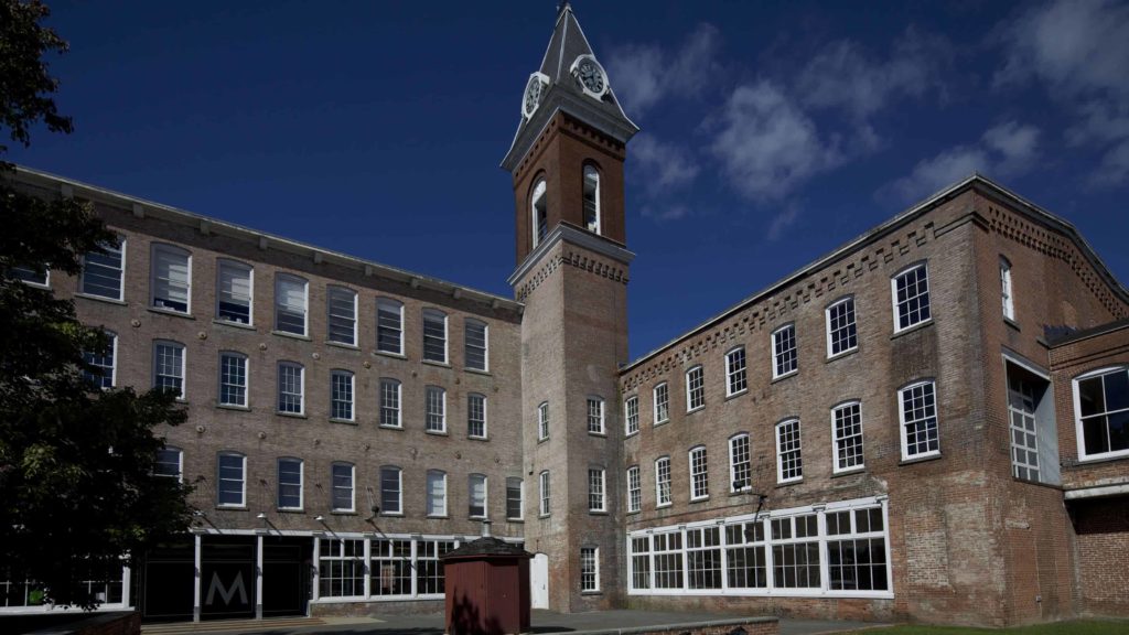 The courtyard and the clocktower sit at Mass MoCA's entrance.