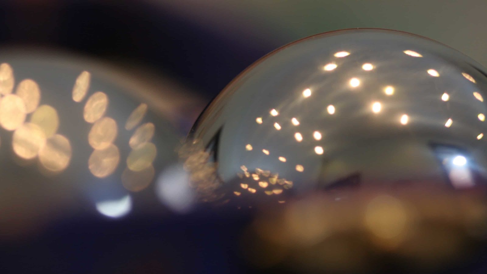 Light reflects the curves of metallic globes.