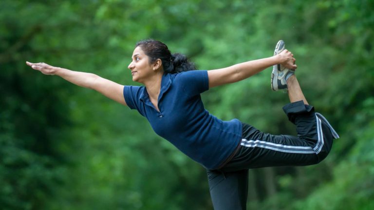 'Reshma and Yoga' — an agile woman balances freely on one leg.