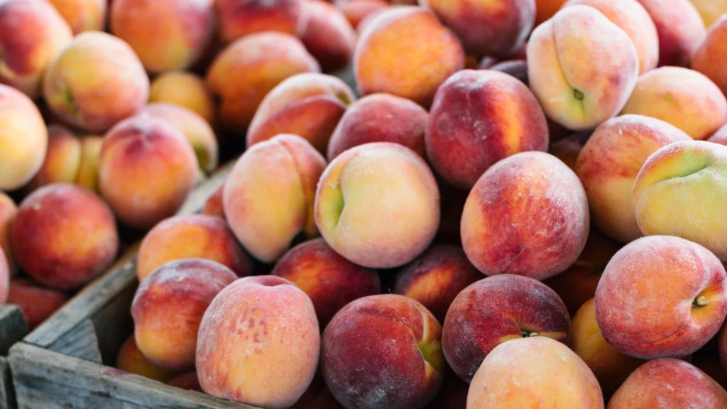 A tumble of fresh peaches from Squamscott Orchards waits at the Great Barrington Farmers Market. Press photo courtesy of the market.