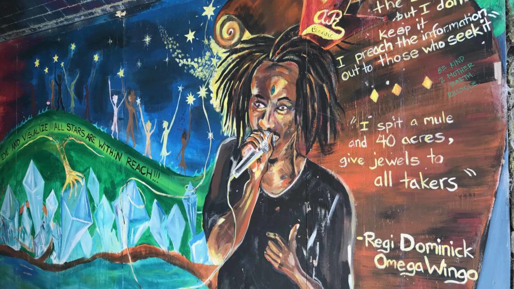 A local artist has painted a vivid mural as part of a community art project on the old underpass below the railroad tracks in Great Barrington.
