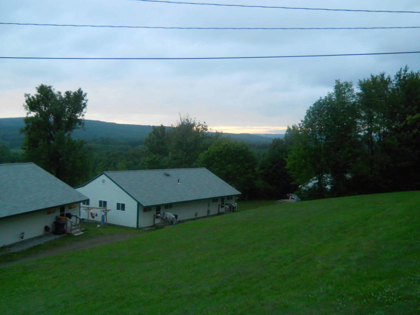 The sun sets over the hill behind Girls' Row in 2013.
