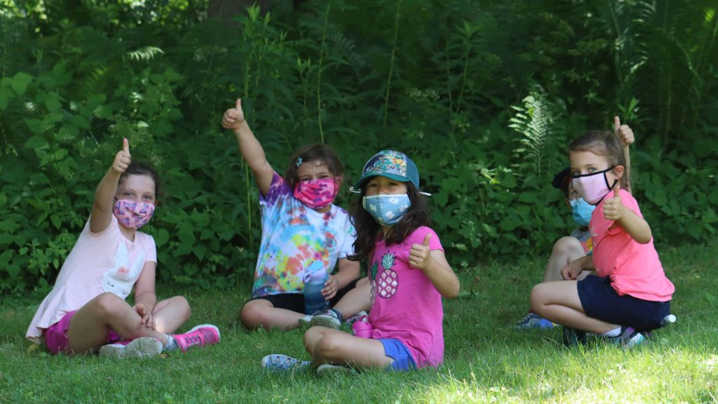 Campers at Mass Audubon's Pleasant Valley Sanctuary explore the outdoors while wearing masks.