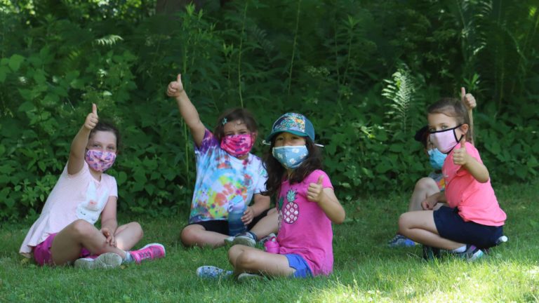 Campers at Mass Audubon's Pleasant Valley Sanctuary explore the outdoors while wearing masks.