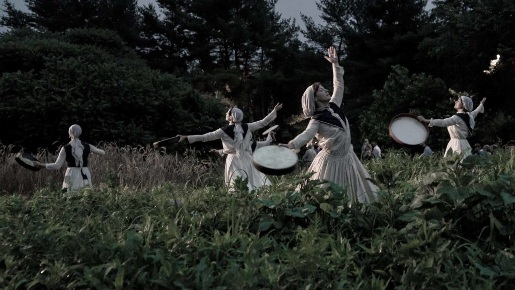 Dancers move in a procession like Shakers at dusk in Double Edge Theatre's 'We the People.'