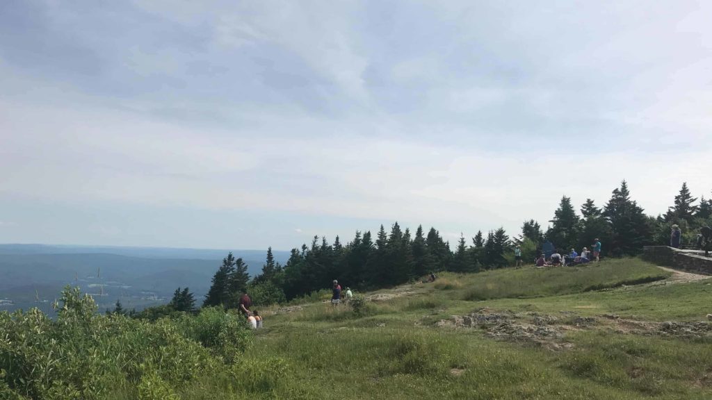 Visitors at the summit of Mount Greylock look out across 70 miles.