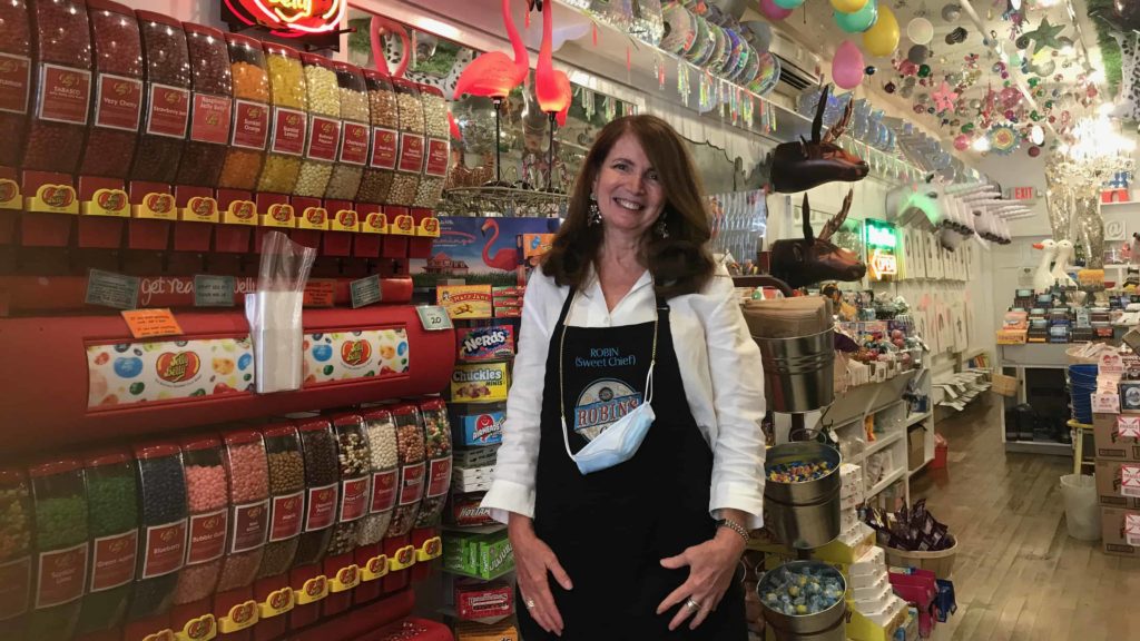 Owner Robin Helfand stands among her sweet and colorful wares at Robin's Candy in Great Barrington.