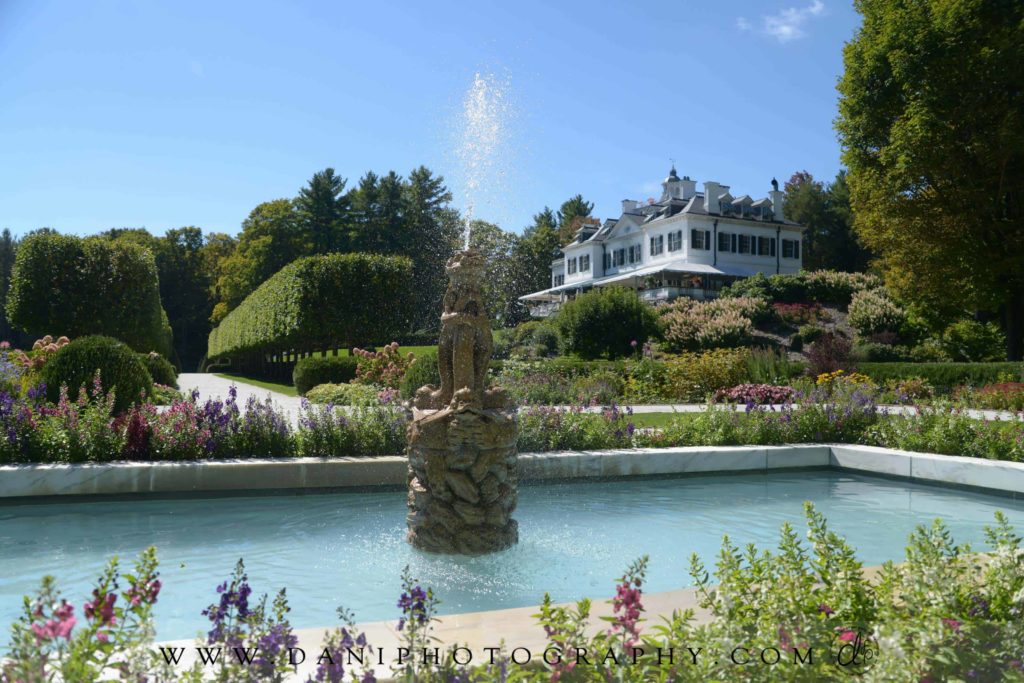 Spray flies from the fountain in the flower gardens at The Mount, Edith Wharton's historic house in Lenox.