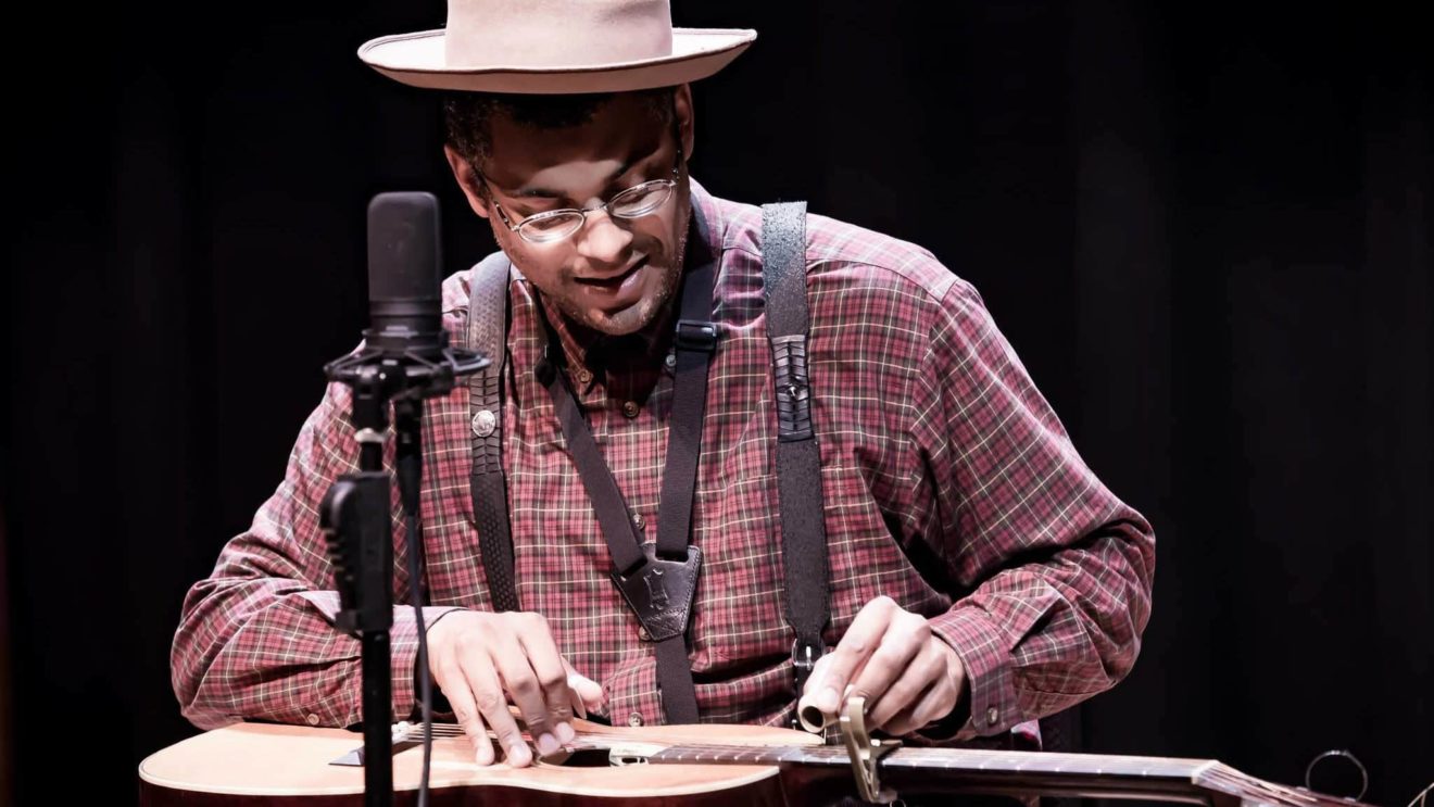 Grammy-winning musician Dom Flemons strums his guitar with deft fingers. Press courtesy photo