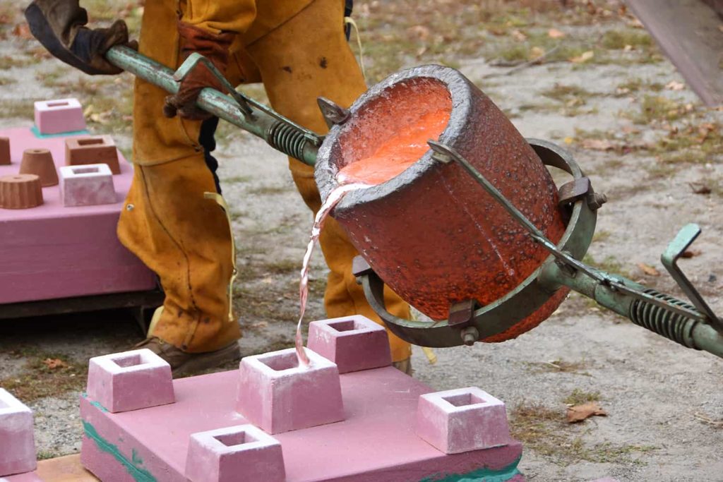 A team pours molten aluminum at Salem Art Works. Press image courtesy of SAW.