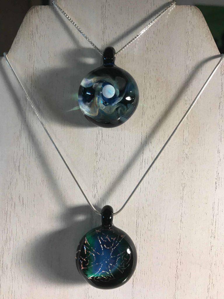 Pendants gleam clear and bluegreen at at Cheshire Glassworks.