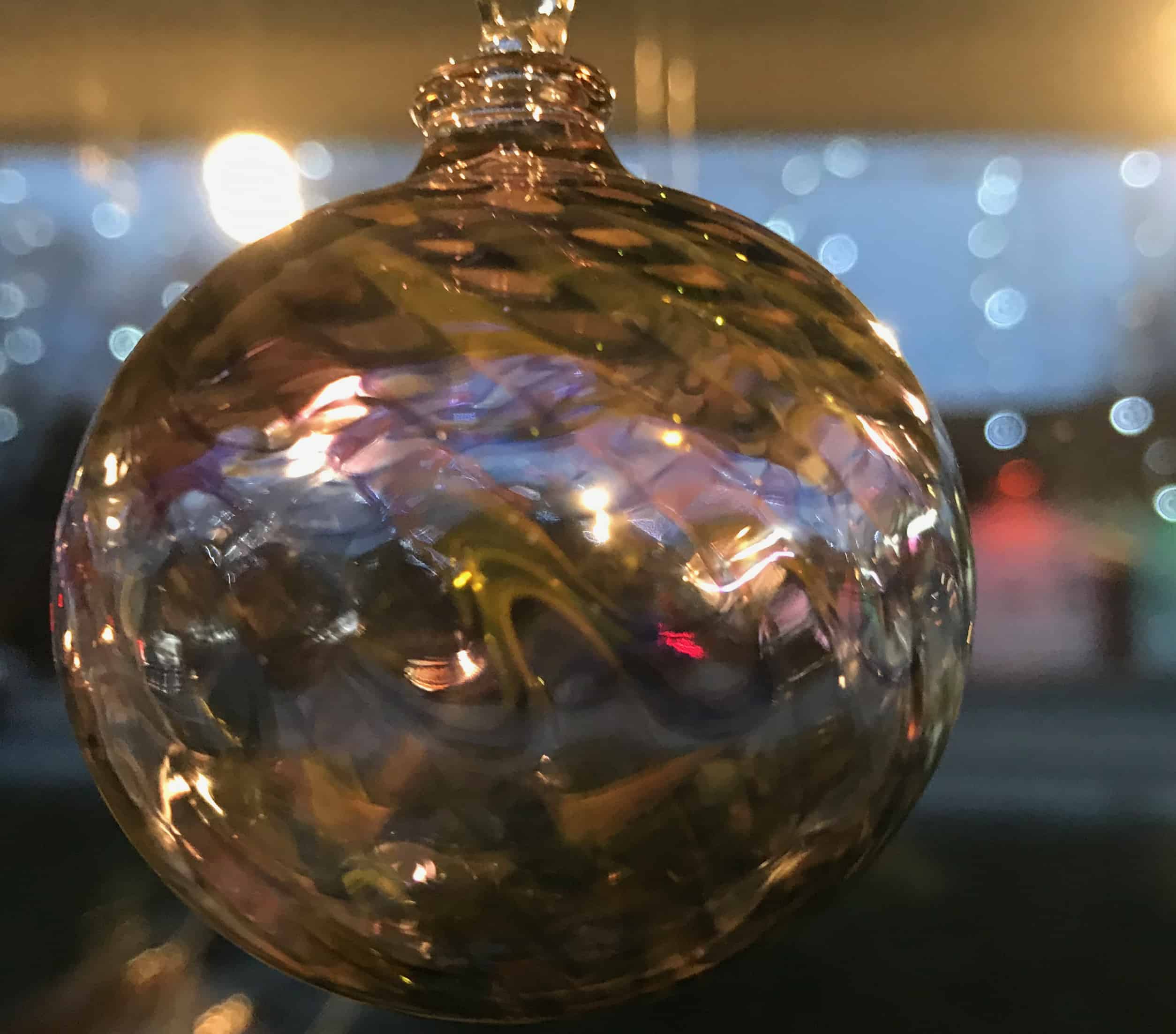 A handmade glass ornament glistens at Cheshire Glassworks.