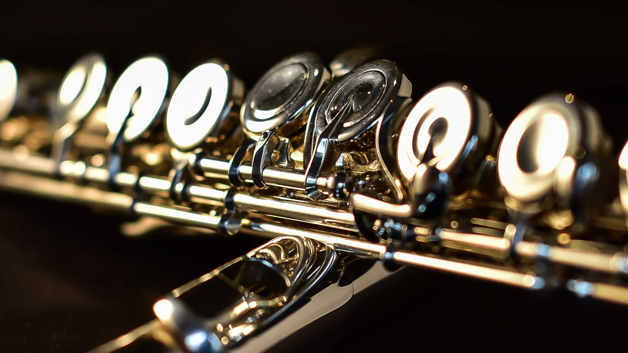 Silver flutes glow against the dark. Creative Commons courtesy photo.
