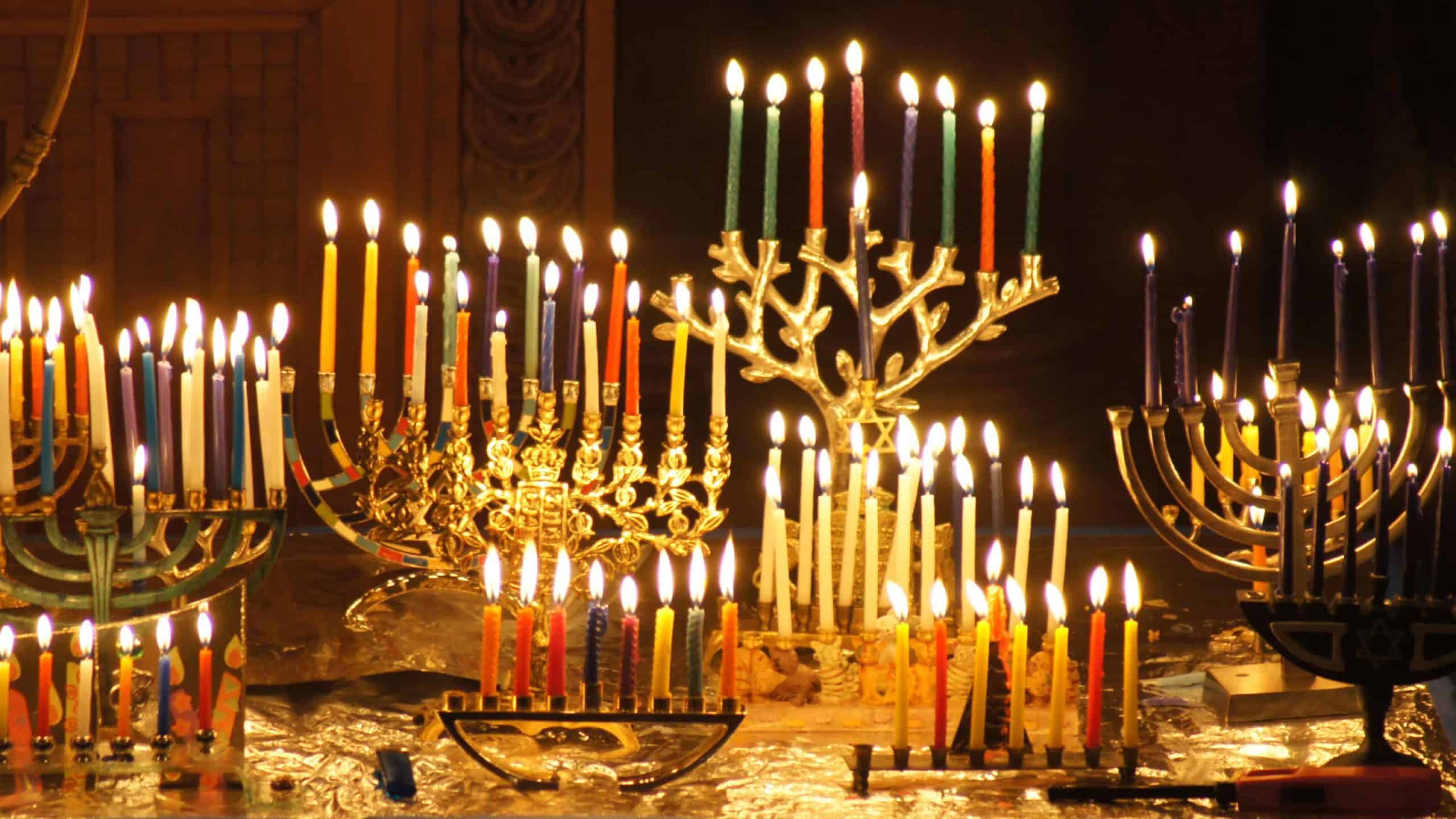 Menorahs gleam on the seventh night of Hanukkah. Creative Commons courtesy photo.