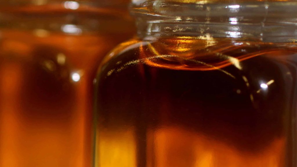 Maple syrup gleams amber in the light. Creative Commons courtesy photo