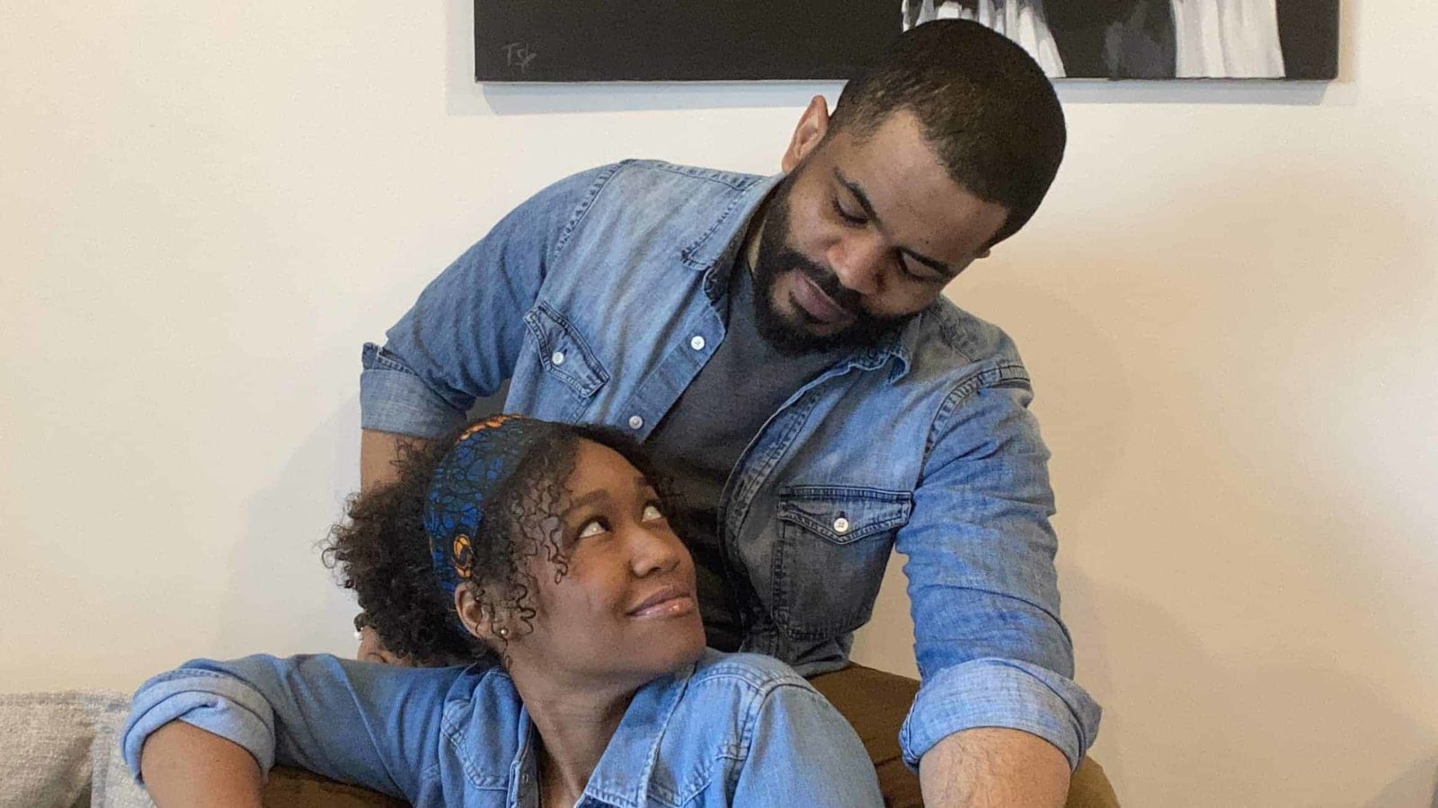 Boston-based actors Elle Borders and Brandon G. Green, a couple in real life as well as on stage, sit together on the couch as they rehearse for The Light with WAM Theatre.